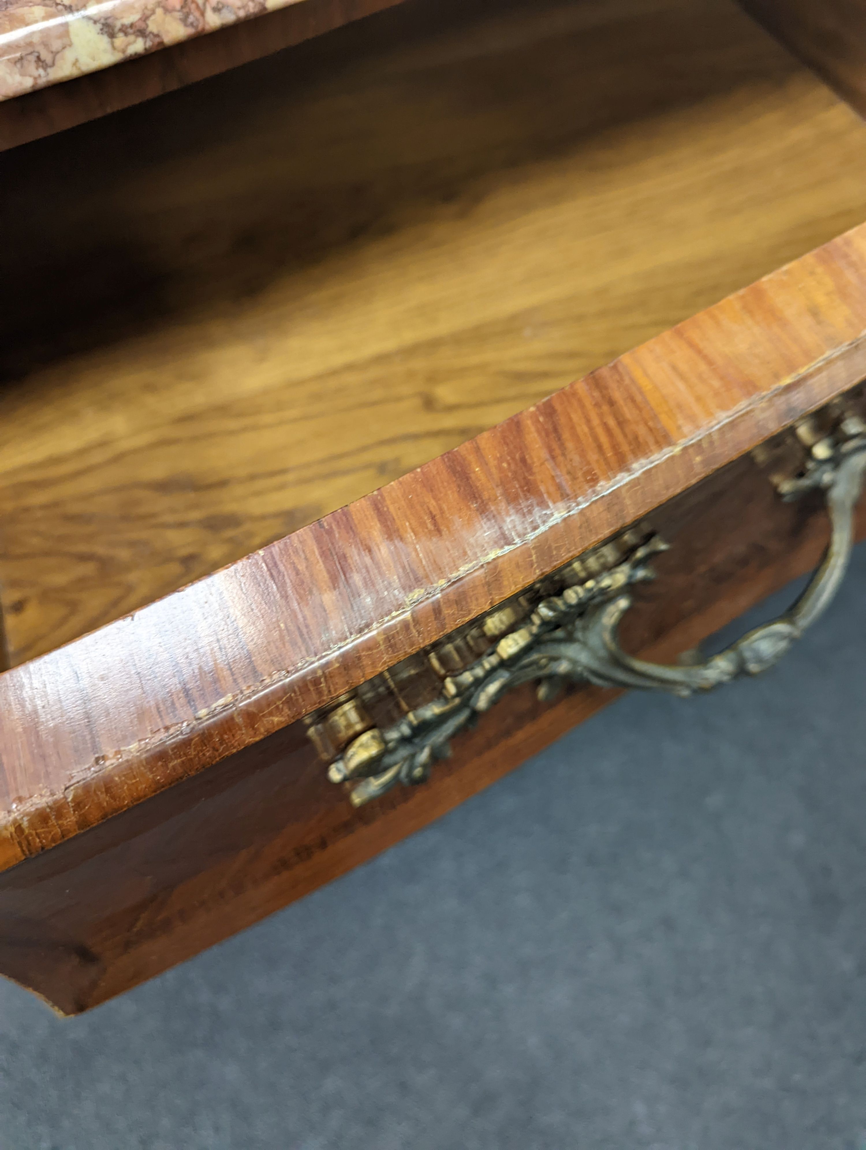 A Louis XV style marble topped serpentine bombe commode - impressed maker's stamp, M.P., width 140cm, depth 59cm, height 90cm